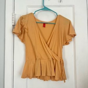 small orange cross over shirt